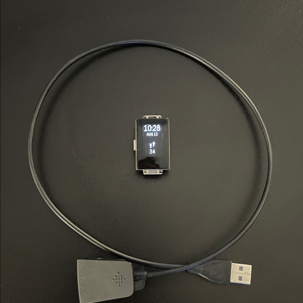 Black Fitbit Charge 3 fitness Tracker with Charger